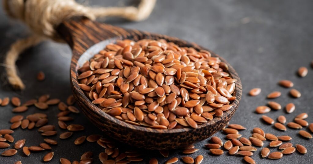 Close-up of flax seeds in a spoon, a natural stool softener