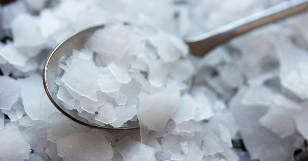 Close up of magnesium flakes in a spoon