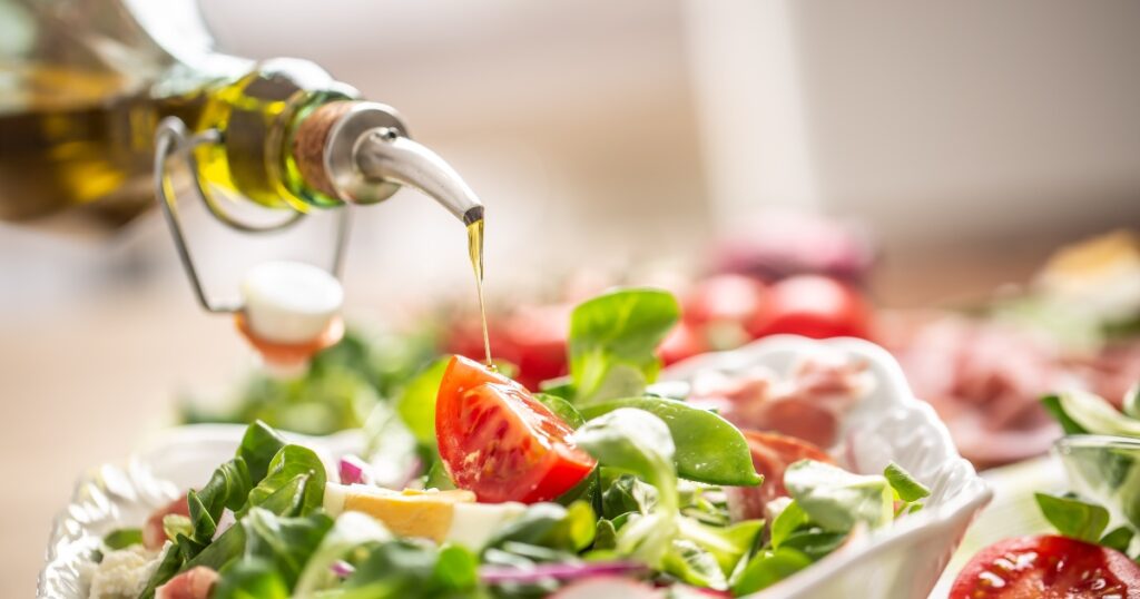 Bowl of salad with olive oil as a natural stool softener