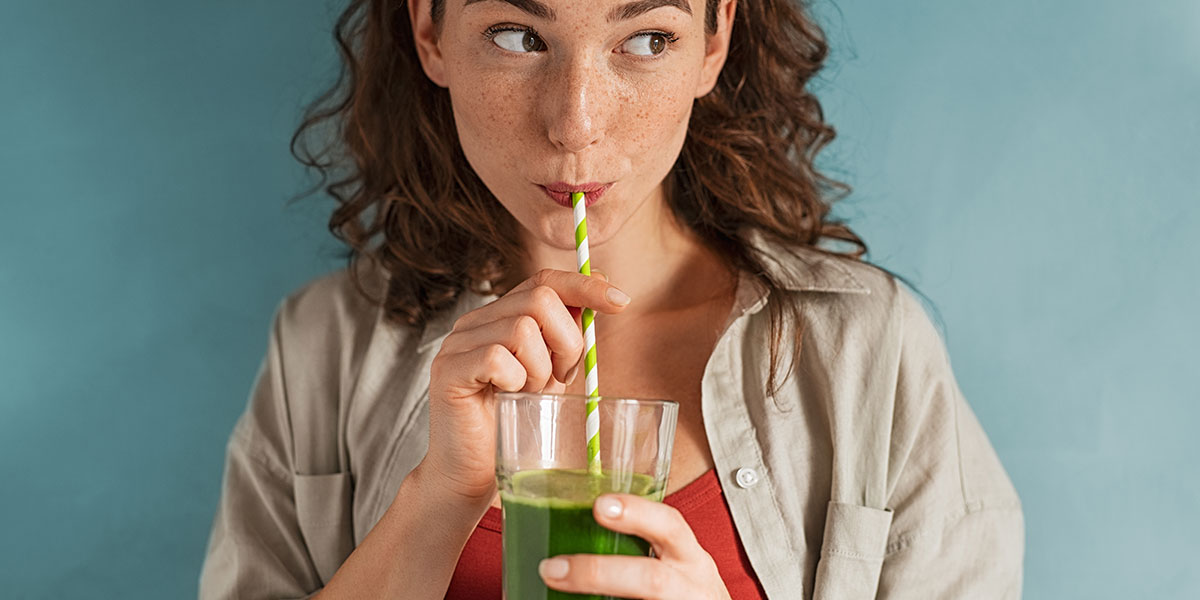 how to clean your stomach and intestines naturally woman drinks juice